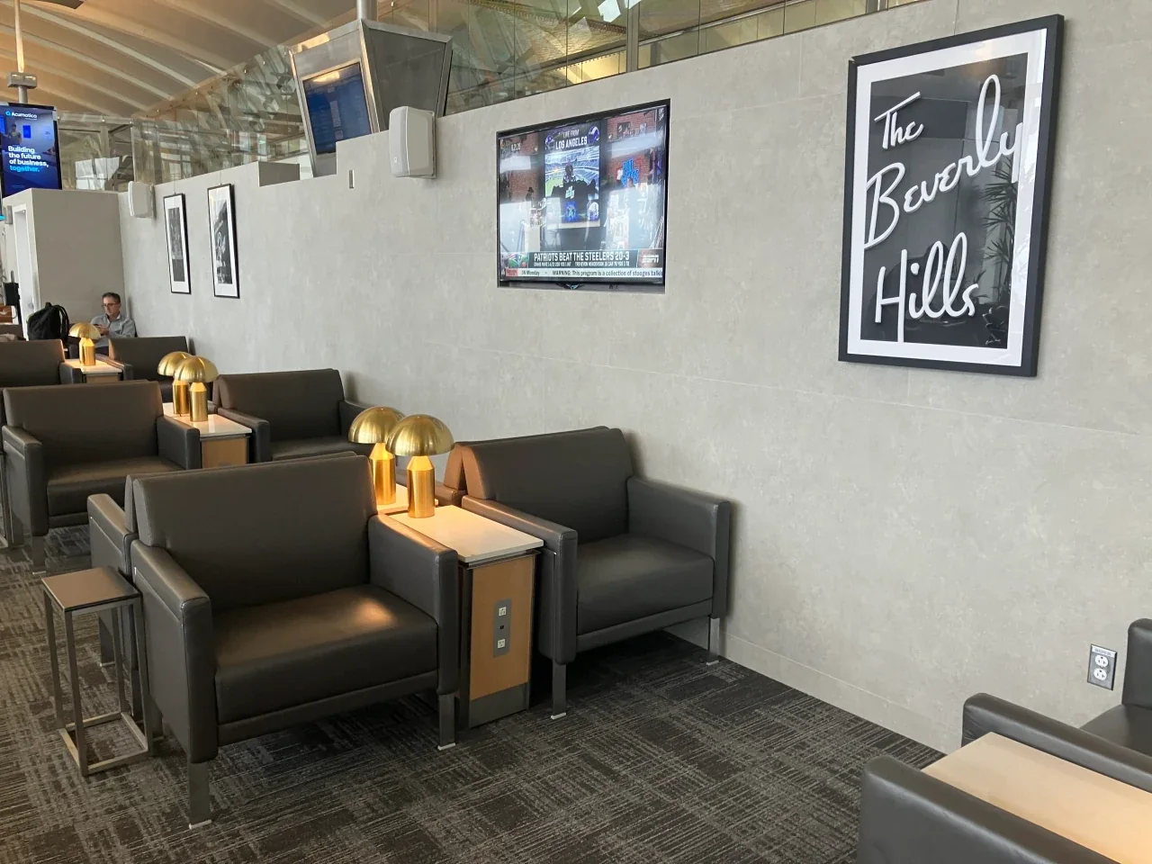 Hollywood-themed artwork in the LAX temporary Admirals Club